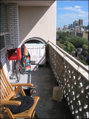 Looking out toward the east and the 'utilitarian' side of my balcony.  This is where I keep my bike and the recycle bins and my laundry racks.