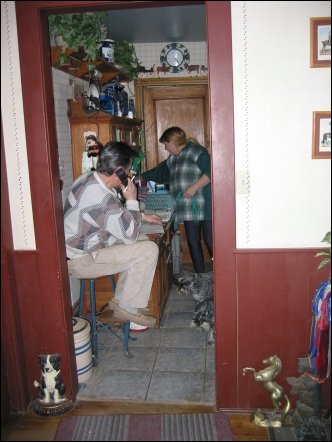 Hazel works in the kitchen as Danny talks on the phone. Hazel has been an award winning breeder in Canada for eight years.